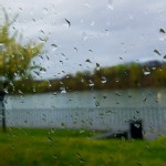 A rainy blurred photo of a river